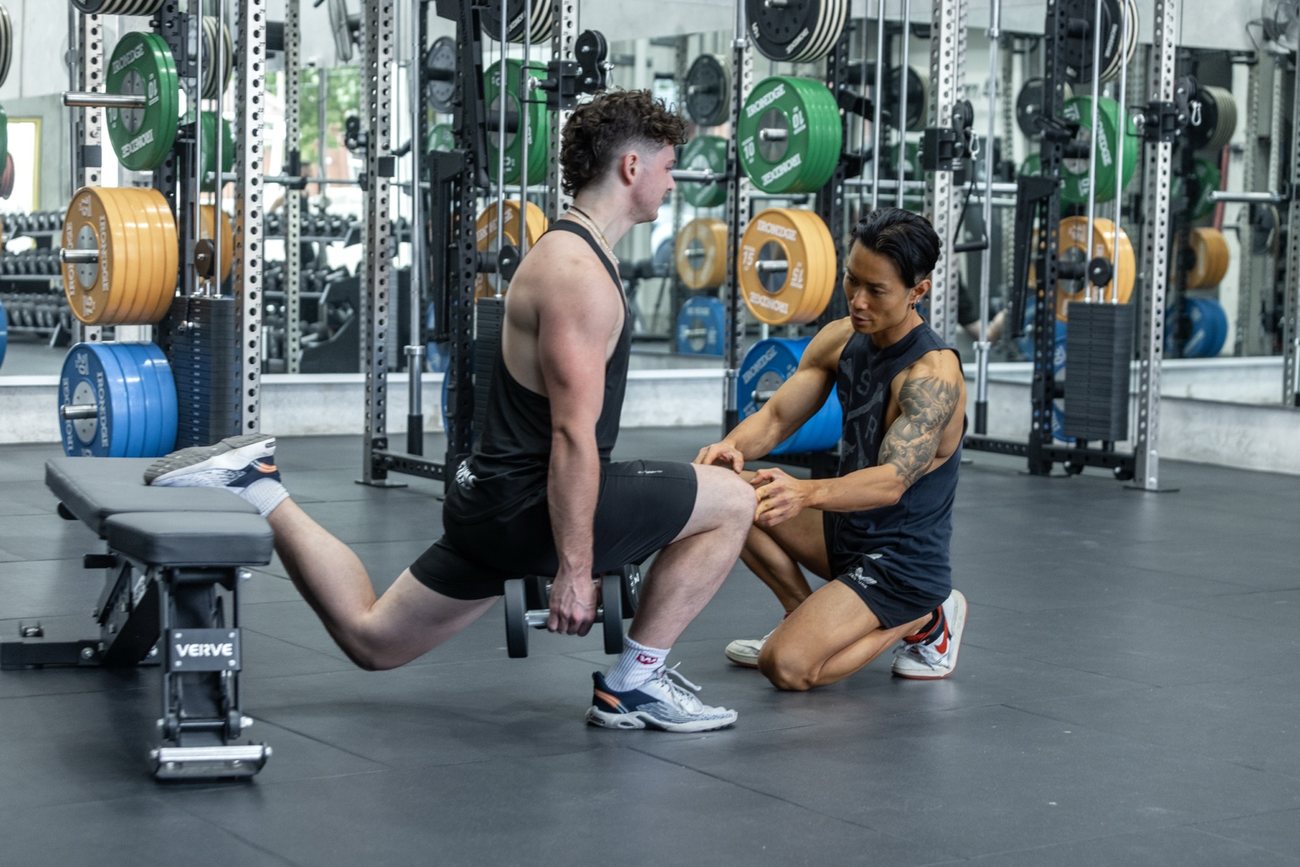 Toru coaching a client during a strength session